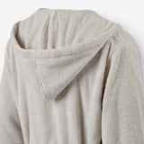Close-up of the back hood detail on a light taupe terry cotton bathrobe.