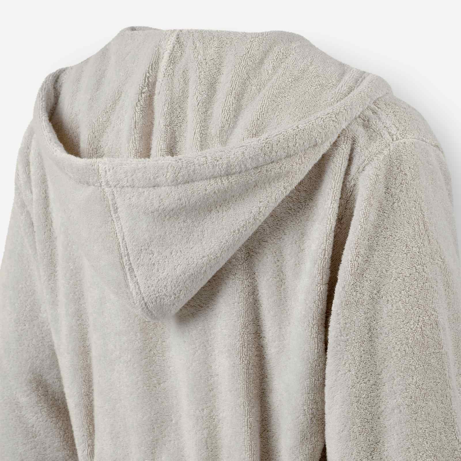 Close-up of the back hood detail on a light taupe terry cotton bathrobe.
