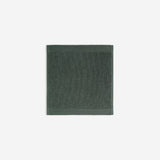 Dark green organic cotton washcloth.