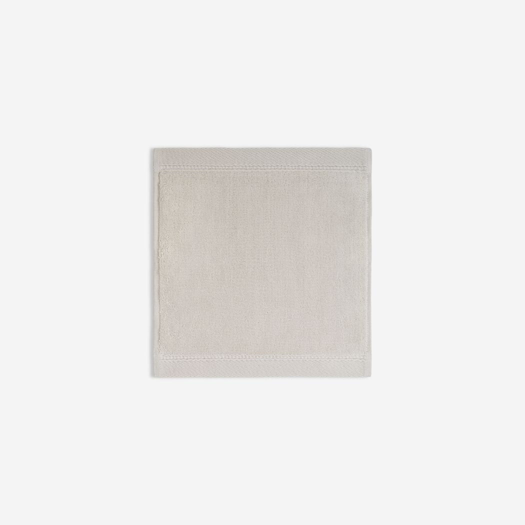 Light grey organic cotton washcloth.