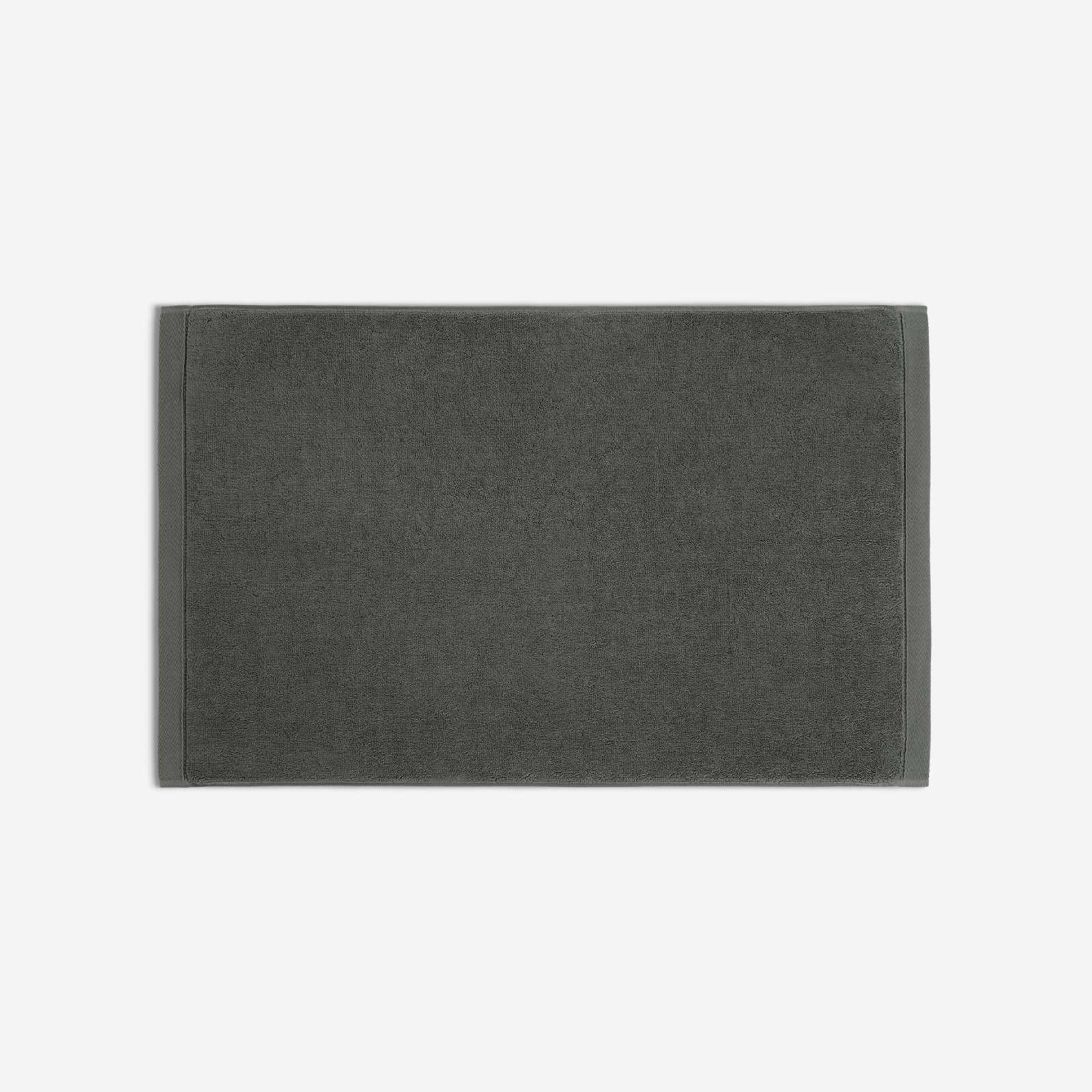 Charcoal gray cotton bath sheet in horizontal orientation with woven border bands, shown against a white background.