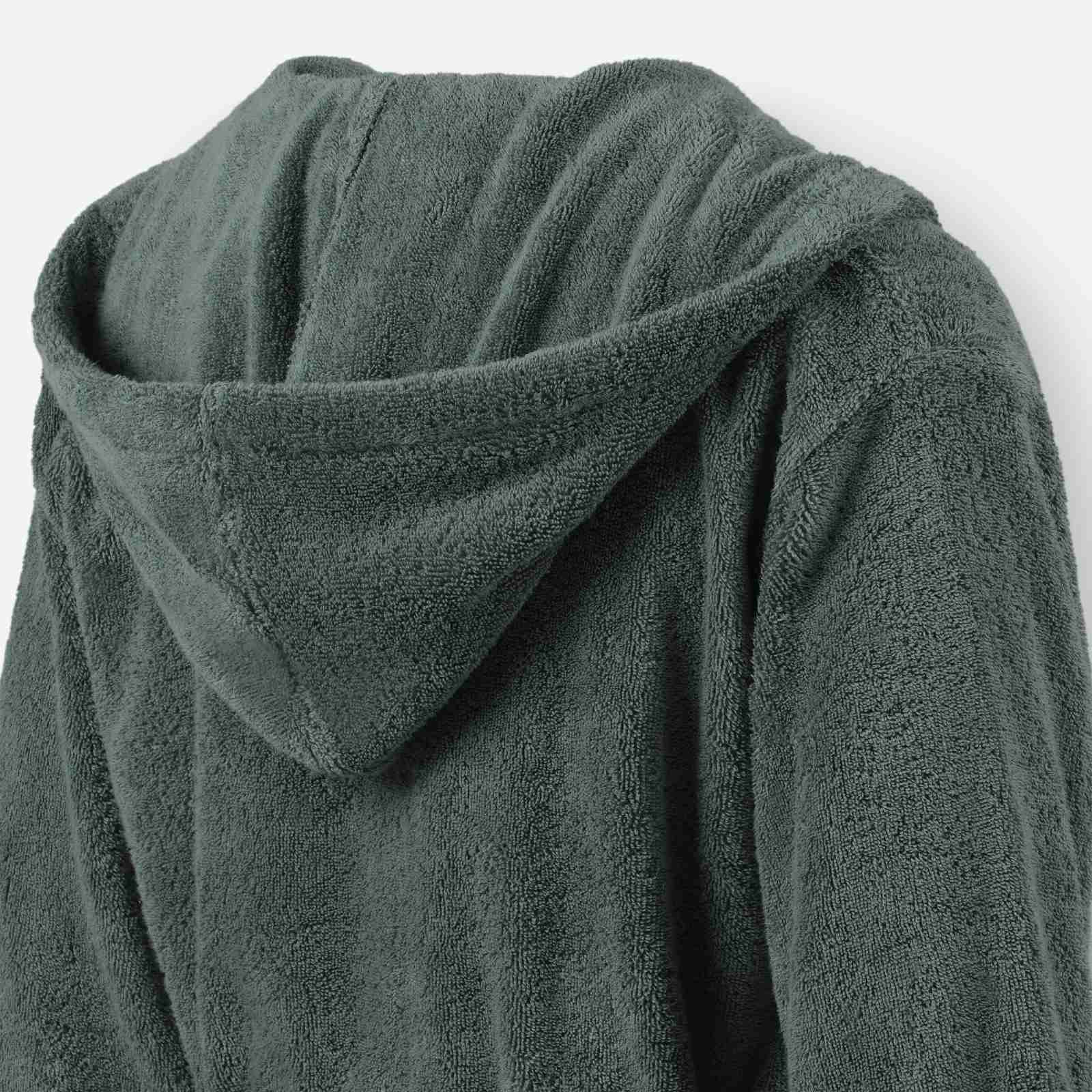 Close-up of a mosstone terry cotton bathrobe showing the hood detail and plush texture.