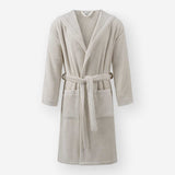 Light taupe hooded terry cotton bathrobe with belt and front pockets, shown against a neutral background.