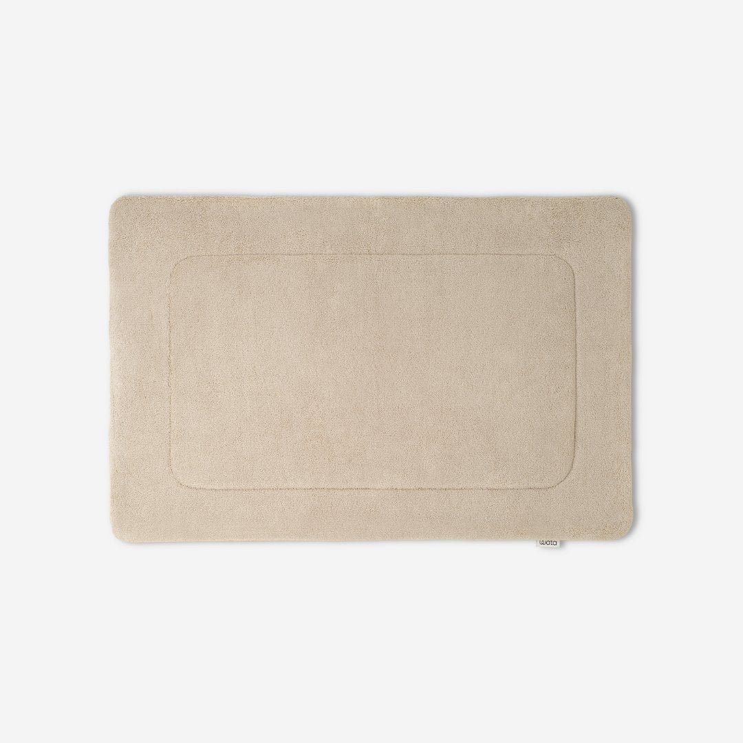 WATA VIVO Organic Cotton bath mat in sand, 1300 GSM, top view, 60 x 90 cm.