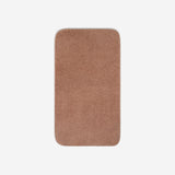 Top view of a dusty rose cotton bath towel with rounded corners, displayed flat on a white background.