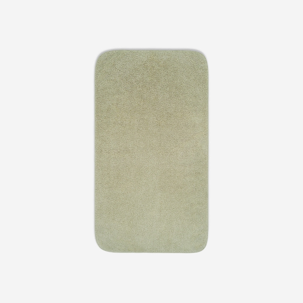 Top view of a light grey organic cotton towel laid flat with rounded corners, shown on a white background.