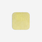 Yellow organic cotton washcloth.