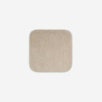 Beige organic cotton washcloth.