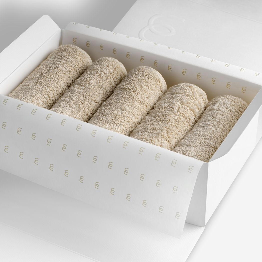Beige organic cotton washcloth set.