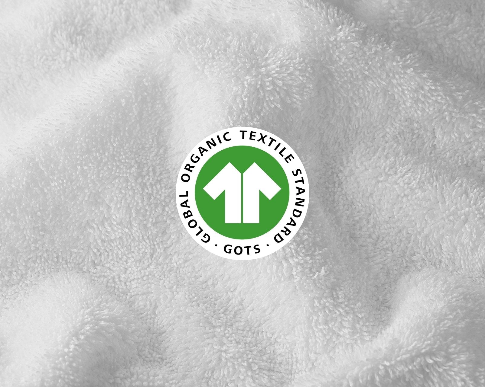 Close-up of a textured fabric surface with a Global Organic Textile Standard (GOTS) logo.