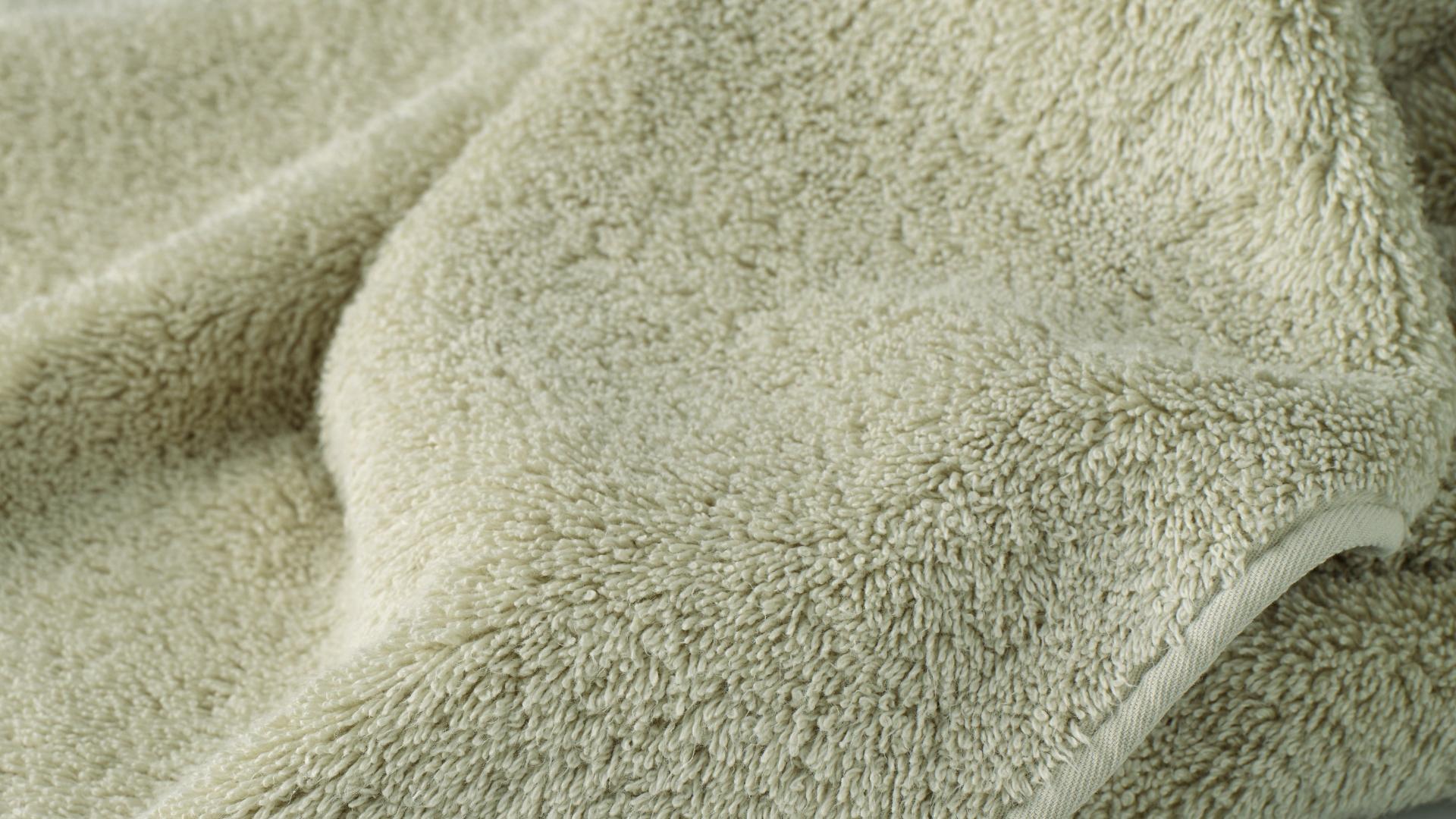 Close-up of a green textured fabric.